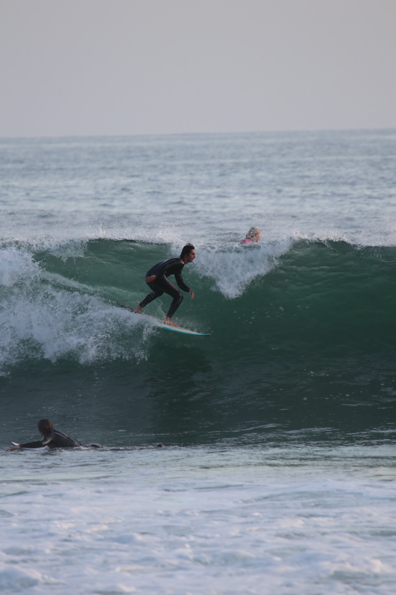 Advanced surfer carving on a green wall